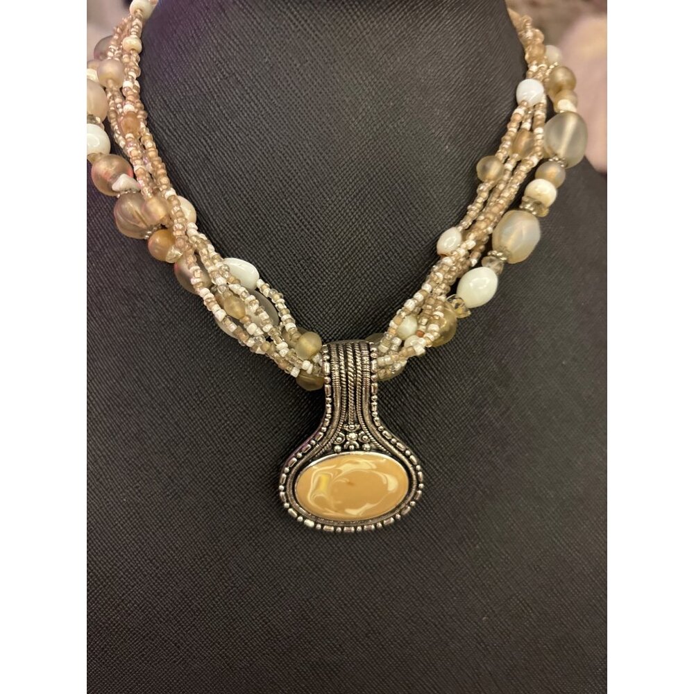 Beaded Multi-Strand Necklace With Swirled Beige Pendant On Silver-Tone Setting
